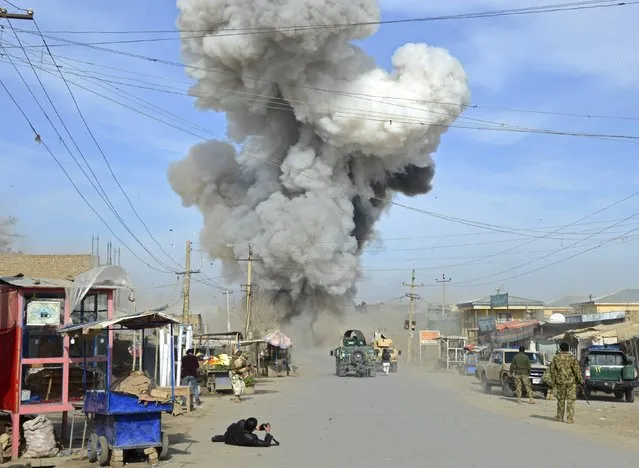 Smoke rises in the sky after a suicide car bomb attack in Kunduz province February 10, 2015. Taliban insurgents launched an attack on a police headquarters in northern Afghanistan, provincial police spokesman Sayed Sarwar Hosseini said. At least two policemen were wounded in the attack, and five suicide attackers were killed by Afghan forces, Hosseini reported. (Photo by Reuters/Stringer)