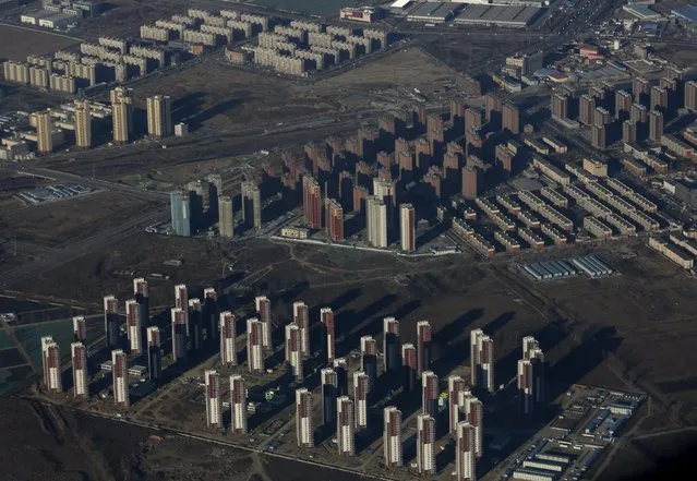 Apartments are pictured from a plane outskirt of Beijing January 8, 2016. (Photo by Kim Kyung-Hoon/Reuters)
