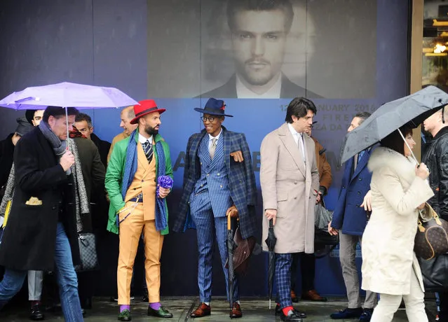 Visitors attend the 89th Pitti Immagine Uomo menswear fashion event in Florence, Italy, 14 January 2016. The exhibition of men's clothing and accessory collections runs from 12 to 15 January. (Photo by Maurizio Degl' Innocenti/EPA)
