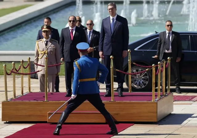Egyptian President Abdel Fattah el-Sisi, center left, and Serbian President Aleksandar Vucic, center right, review the honor guard at the Serbia Palace in Belgrade, Serbia, Wednesday, July 20, 2022. Abdel Fattah el-Sisi is on a three-day official visit to Serbia. (Photo by Darko Vojinovic/AP Photo)
