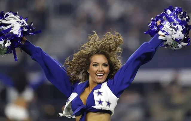 A Dallas Cowboys Cheerleader performs as the Cowboys play the Detroit Lions during the first half at AT&T Stadium on December 26, 2016 in Arlington, Texas. (Photo by Ronald Martinez/Getty Images)