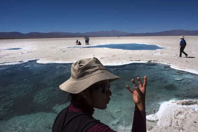 Local indigenous communities have a spiritual connection with the pools, known as “eyes”, in the Salinas Grandes salt flat in Argentina's high Andes. Mining interests are eager to exploit the lithium deposits of this popular tourist area and delicate ecosystem. The promise of “clean” energy replacing our use of fossil fuels must be balanced with knowing the impact that the minerals and metals involved in the process are having on communities and the environment around the world. (Photo by Michael Robinson Chavez/The Washington Post)