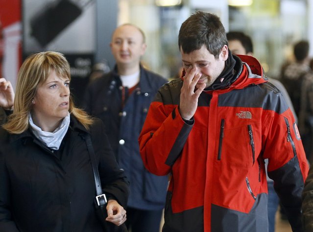 A family member of a passenger killed in Germanwings plane crash reacts as he arrives at Barcelona's El Prat airport March 24, 2015. Lufthansa's budget carrier Germanwings confirmed its flight 4U9525 from Barcelona to Duesseldorf crashed in the French Alps. It said on its Twitter feed that 144 passengers and six crew members were on board the Airbus A320 aircraft. (Photo by Albert Gea/Reuters)