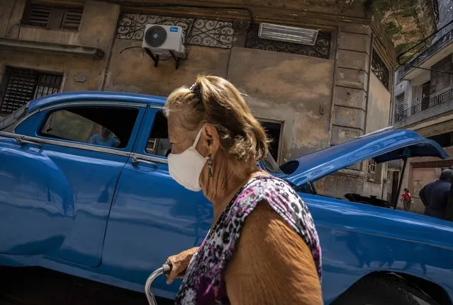 A woman wears a protective face mask as a precaution against the spread of the new coronavirus in Havana, Cuba, Wednesday, June 2, 2021. (Photo by Ramon Espinosa/AP Photo)