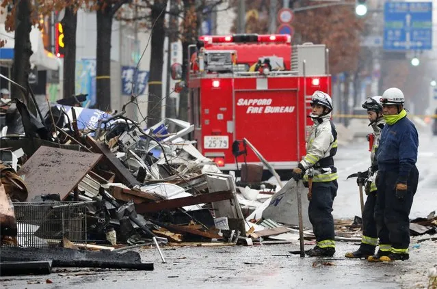 Firefighters work at the scene of an explosion in Sapporo, Japan, Monday, December 17, 2018. Dozens of people were injured in the explosion Sunday night at a Japanese restaurant in northern Japan, police said. The explosion occurred in Sapporo, the capital city of Japan's northern main island of Hokkaido, and caused nearby apartment buildings and houses to shake. ( Photo by Masanori Takei/Kyodo News via AP Photo)