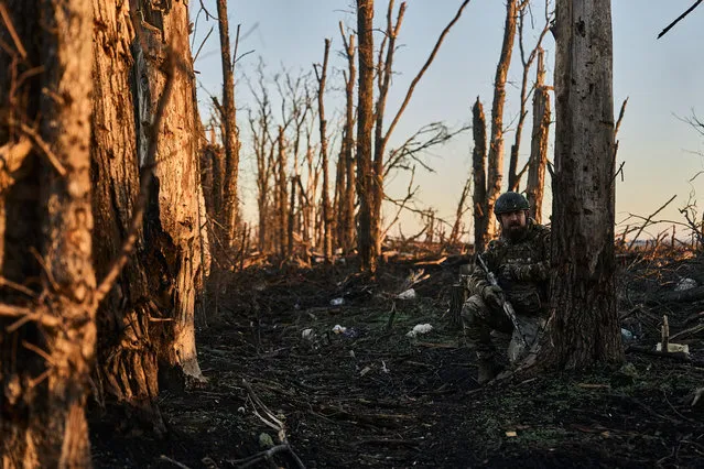 An infantry soldier takes cover from enemy fire near Vuhledar at dawn on November 7, 2023 near Vuhledar, Ukraine. Vuhledar has seen intense fighting in the 20 months since Russia's full-scale invasion of Ukraine. Last week, the Ukrainian president said his forces had repelled a Russian assault in the direction of Vuhledar, “causing heavy losses in this war to the enemy: dozens of pieces of equipment, many killed and wounded”. (Photo by Kostya Liberov/Libkos via Getty Images)