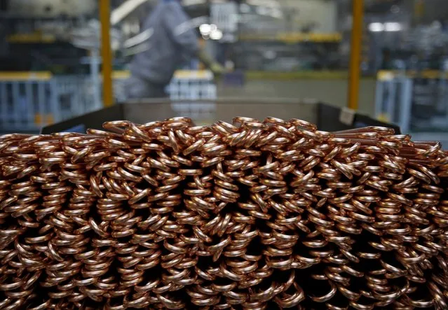 Copper tubes, which exchange heat in outdoor air conditioning units of Daikin Industries Ltd, are stacked at the production line of the company's Kusatsu factory in Shiga prefecture, western Japan March 20, 2015. (Photo by Yuya Shino/Reuters)
