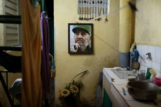 An image of late Cuban President Fidel Castro is seen inside a house in downtown Havana, Cuba, September 12, 2016. (Photo by Alexandre Meneghini/Reuters)