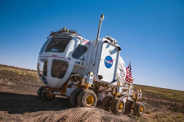NASAs Desert Research and Technology Studies (Desert RATS) team members practice with a Moon rover prototype for future Artemis missions at the Black Point Lava Flow near Flagstaff, Arizona, on October 24, 2022. (Photo by Olivier Touron/AFP Photo)