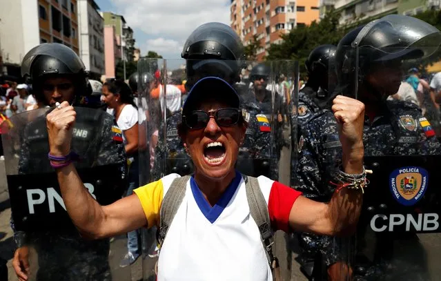 An opposition supporter gestures during a rally in Caracas, Venezuela on March 9, 2019. (Photo by Carlos Garcia Rawlins/Reuters)