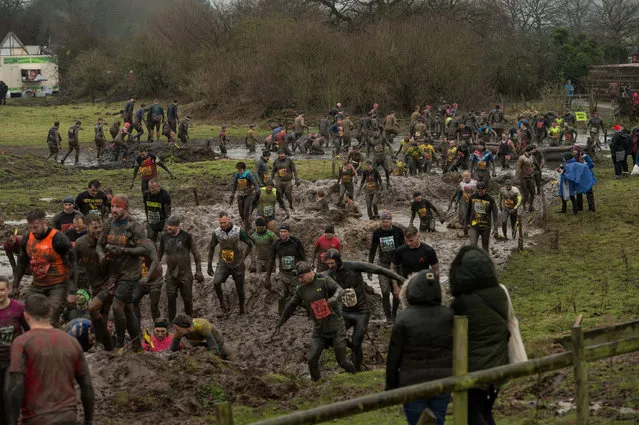 Competitors take part in the “Tough Guy” adventure race near Wolverhampton, central England, on January 29, 2017. (Photo by Oli Scarff/AFP Photo)