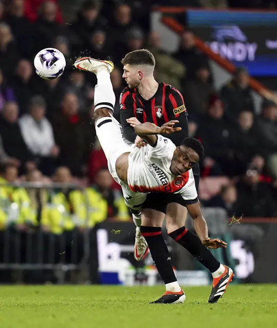 Bournemouth's Chris Mepham, background and Luton Town's Chiedozie Ogbene vie for the ball, during the English Premier League soccer match between Bournemouth and Luton Town,  at the Vitality Stadium,  in Bournemouth, England, Wednesday, March 13, 2024. (Photo by John Walton/PA Wire via AP Photo)
