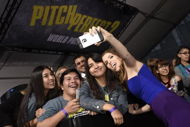 Anna Kendrick takes a selfie with a fan at the world premiere of “Pitch Perfect 2” at Nokia Theatre L.A. Live on Friday, May 8, 2015, in Los Angeles. (Photo by Chris Pizzello/Invision/AP Photo)