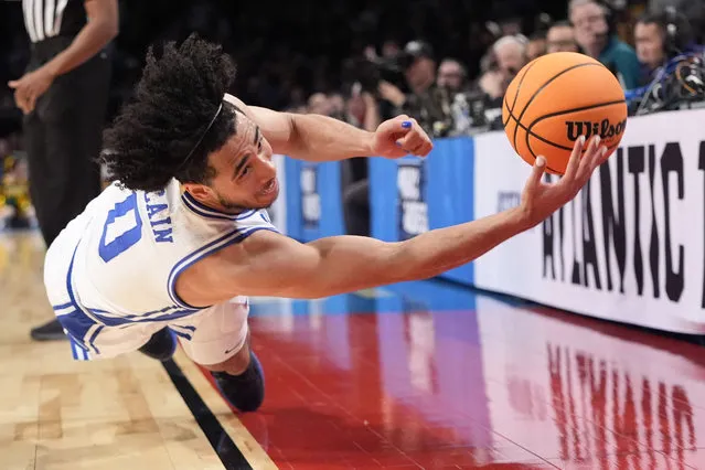 Duke guard Jared McCain dives for the ball during the second half of the team's first-round college basketball game against Vermont in the men's NCAA Tournament, Friday, March 22, 2024, in New York. Duke won 64-47. (Photo by Mary Altaffer/AP Photo)