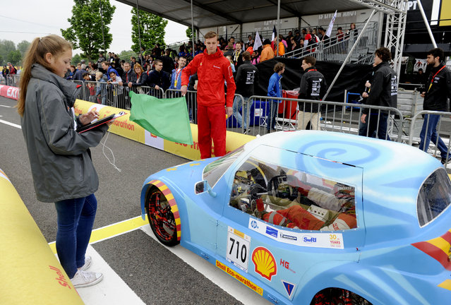 The Carbonizer, #710, a battery electric UrbanConcept competing for team Niepce from Lycee Nicephore Niepce, prepares to enter the track during competition day two of the Shell Eco-marathon Europe 2015 on Saturday, May 23, 2015, in Rotterdam, the Netherlands. (Photo by Patrick Post/AP Images for Shell)