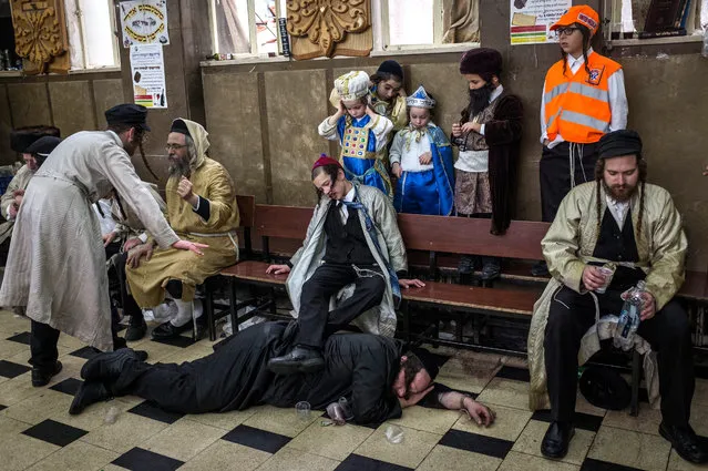 Ultra Orthodox Jews celebrating holiday of Purim on March 13, 2017 in Jerusalem, Israel. The carnival-like Purim holiday is celebrated with parades and costume parties to commemorate the deliverance of the Jewish people from a plot to exterminate them in the ancient Persian empire 2,500 years ago, as described in the Book of Esther. (Photo by Ilia Yefimovich/Getty Images)