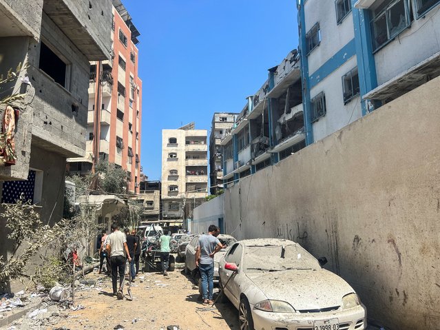 Palestinians inspect the site of an Israeli strike on a UNRWA school sheltering displaced people in Nuseirat refugee camp in the central Gaza Strip on June 6, 2024. (Photo by Emad Abu Shawiesh/Reuters)