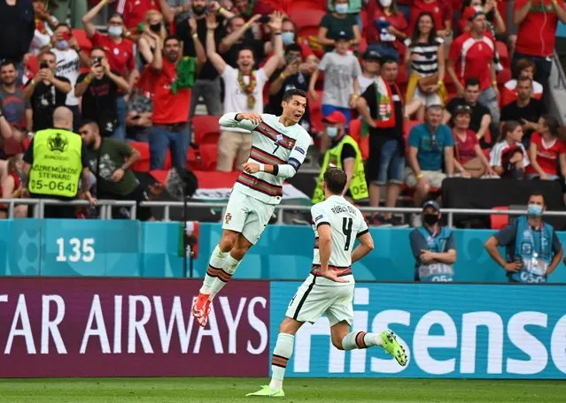 Portugal's Cristiano Ronaldo celebrates scoring their third goal during their Euro 2020 match against Hungary in Budapest on June 15, 2021. (Photo by Attila Kisbenedek/Pool via Reuters)