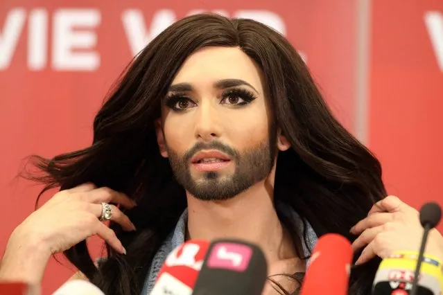 Austrian singer Conchita Wurst attends a press conference in Vienna, Austria Sunday May 11, 2014.  Bearded drag queen Conchita Wurst has made a triumphant return to Austria after winning the Eurovision Song Contest in Copenhagen Saturday,  in what the country's president called a victory for tolerance in Europe. (Photo by Ronald Zak/AP Photo)