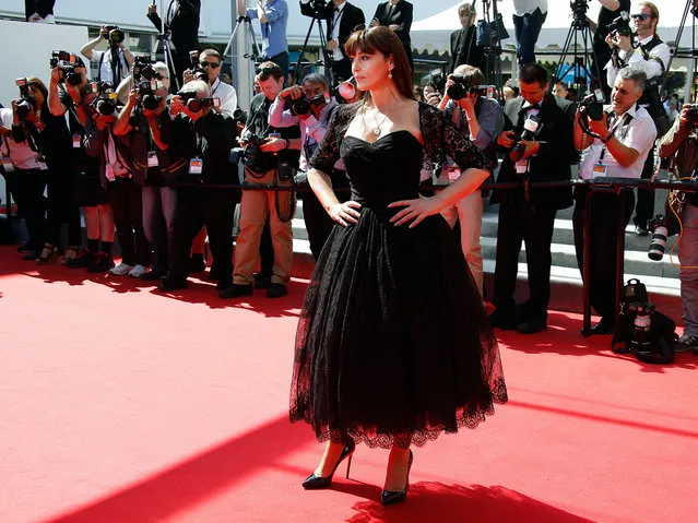 Italian actress Monica Bellucci poses as she arrives for the screening of the film “Le Meraviglie (The Wonders)” at the 67th edition of the Cannes Film Festival in Cannes, southern France, on May 18, 2014. (Photo by Valery Hache/AFP Photo)