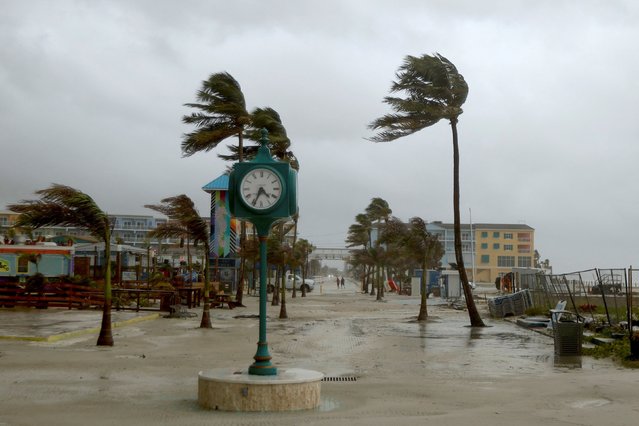 Palm trees blow from Tropical Storm Debby's bands, in Ft. Myers Beach, Florida, United States, on August 4, 2024. (Photo by Maria Alejandra Cardona/Reuters)