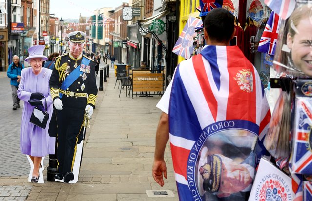 Cardboard cutouts depicting Britain's Queen Elisabeth and King Charles stand near a souvenir shop  following Britain's King Charles' coronation, in Windsor, Britain on May 8, 2023. (Photo by Hannah McKay/Reuters)