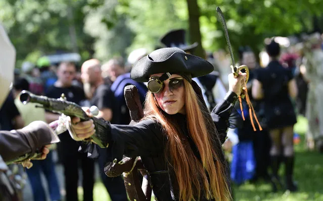 Dressed up people attend a so-called “Victorian Picnic” during the Wave-Gotik-Treffen (WGT) festival in Leipzig, eastern Germany, on June 2, 2017. (Photo by Tobias Schwarz/AFP Photo)