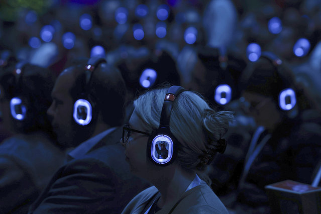 The glow of head sets on people's heads is seen at Stage 2 in Moscone South during the Innovation for Nonprofits: Salesforce for Nonprofits Roadmap Session during the Dreamforce 2024 conference on Wednesday, September 18, 2024 in San Francisco. (Photo by Lea Suzuki/San Francisco Chronicle via AP Photo)