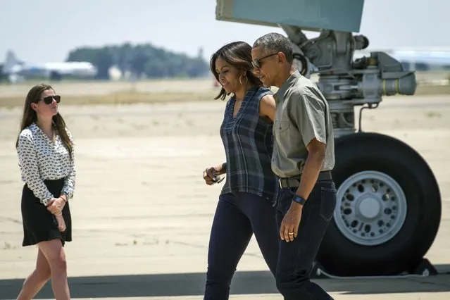 President Barack Obama and first lady Michelle Obama, arrive in Roswell, N.M., Friday, June 17, 2016, on their way to touring Carlsbad Caverns National Park. The President is touring several of the nation's national parks to celebrate the 100th anniversary of the creation of America's national park system. (Photo by Juan Labreche/AP Photo)