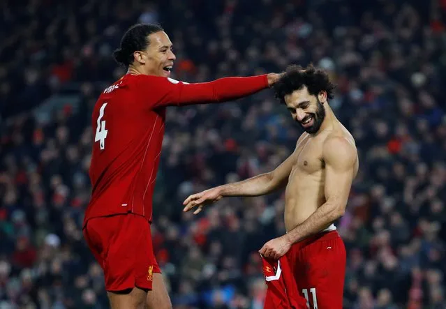 Liverpool's Mohamed Salah celebrates scoring their second goal with Virgil van Dijk against Manchester United at Anfield, Liverpool, Britain, January 19, 2020. (Photo by Phil Noble/Reuters)