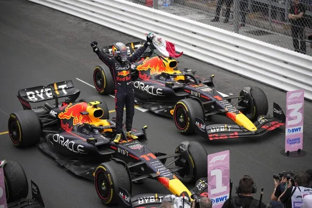 Red Bull driver Sergio Perez of Mexico celebrates after winning the Monaco Formula One Grand Prix, at the Monaco racetrack, in Monaco, Sunday, May 29, 2022. (Photo by Daniel Cole/AP Photo)