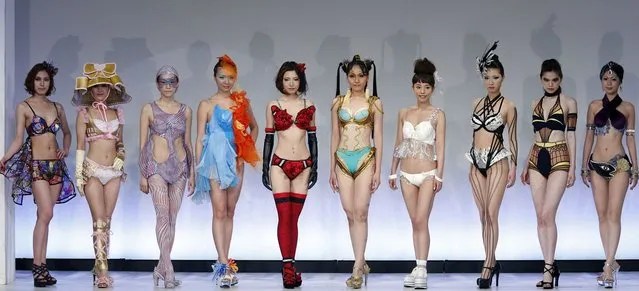 Models display lingerie designs in various themes as they pose at the Triumph Inspiration Award Japan at the Bunka Fashion College in Tokyo on May 30, 2012