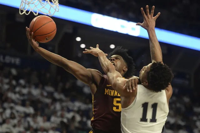 Minnesota's Marcus Carr (5) drives to the basket on Penn State's Lamar Stevens (11) during late first-half action of an NCAA college basketball game, Saturday, February 8, 2020, in State College, Pa. (Photo by Gary M. Baranec)/AP Photo
