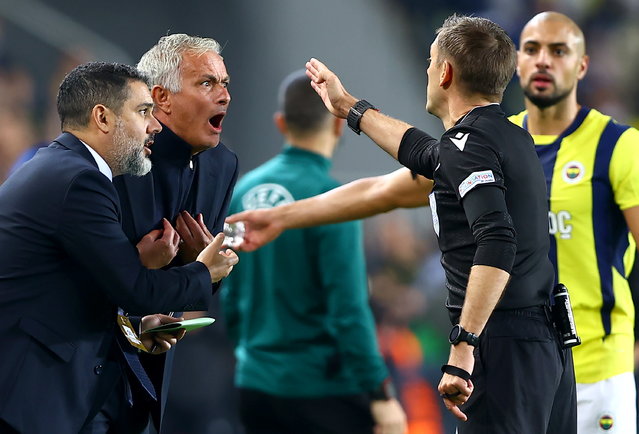 Referee Clement Turpin sends Fenerbahce head coach Jose Mourinho (2-L) to the stands during the UEFA Europa League soccer match between Fenerbahce SK and Manchester United, in Istanbul, Turkey, 24 October 2024. (Photo by Tolga Bozoglu/EPA)