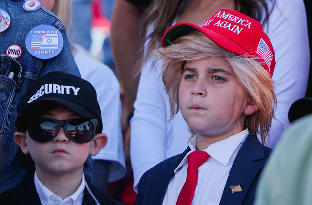 Boys wear Security and Make America Great Again hats during Donald Trump's Make America Great Again Rally in Latrobe, Pennsylvania, on October 19, 2024. (Photo by Brian Snyder/Reuters)