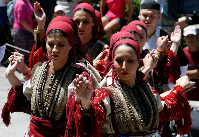 Women take part in a three-day traditional Macedonian wedding celebration held on every “Petrovden”, or St. Peter's Day, in Galicnik, North Macedonia on July 17,2022. (Photo by Ognen Teofilovski/Reuters)