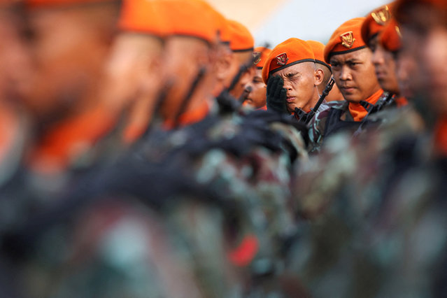 An Indonesian Air Force personnel wipes his face before the march during the 79th Indonesian Military Anniversary celebrations at the National Monument (Monas) complex in Jakarta, Indonesia, on October 5, 2024. (Photo by Ajeng Dinar Ulfiana/Reuters)
