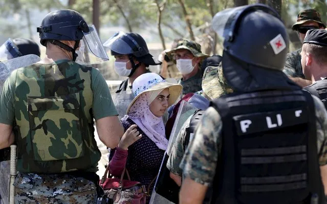 Migrants enter Macedonia near Gevgelija after crossing the border with Greece, September 1, 2015. (Photo by Ognen Teofilovski/Reuters)