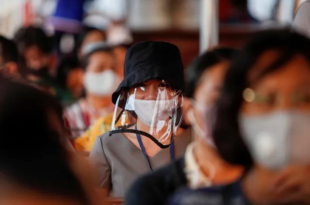 A woman wears a protective face mask while commuting by boat, at the Chao Phraya river during the coronavirus disease (COVID-19) outbreak, in Bangkok, Thailand, April 15, 2020. (Photo by Jorge Silva/Reuters)