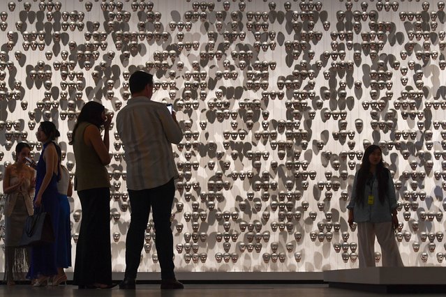 Artists showcase works during 11th Asia Pacific Triennial of Contemporary Art at Gallery of Modern Art in Brisbane, Friday, November 29, 2024. The 11th Asia Pacific Triennial of Contemporary Art is showcasing seventy artists, collectives and projects from over thirty countries. (Photo by Jono Searle/AAP Image)