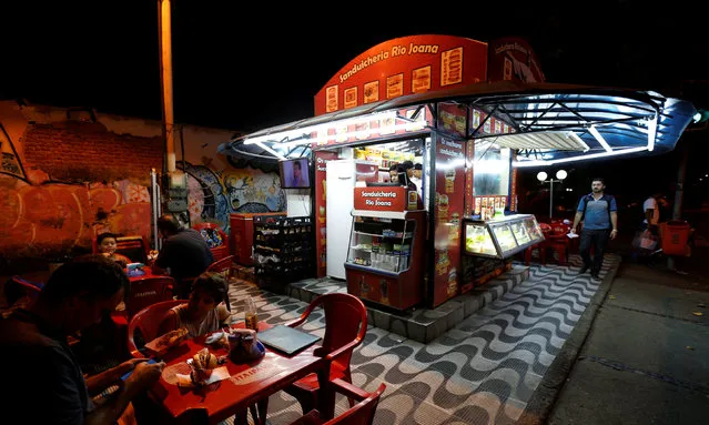 A view of a kiosk selling podrao, the Portuguese word for “rotten” (a hotdog or burger type sandwich assembled according to taste), is seen in Rio de Janeiro, Brazil, April 8, 2016. (Photo by Sergio Moraes/Reuters)