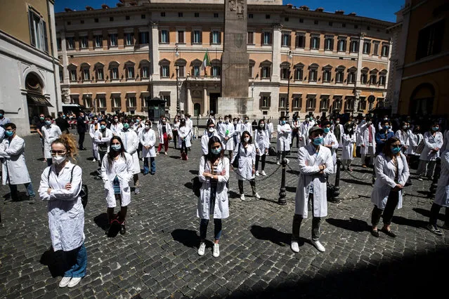 Medical students, graduate students and young doctors protest in front of the Italian Parliament during the second phase of the coronavirus disease (COVID-19) pandemic, emergency in Rome, Italy, 27 May 2020. According to media reports, demonstrators denounced the fragility of the national health system. (Photo by Angelo Carconi/EPA/EFE)