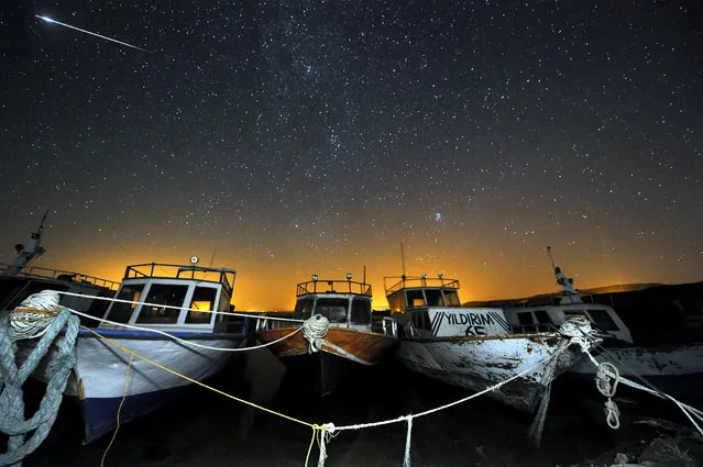 Perseid meteors streak across the sky during the annual Perseid meteor shower above Van Lake, in eastern Turkey, Van on August 12, 2016. (Photo by Sitki Yildiz/Anadolu Agency/Getty Images)