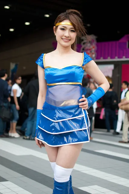 Cute Japanese Cosplay Girls. Sengoku Otome event booth girl