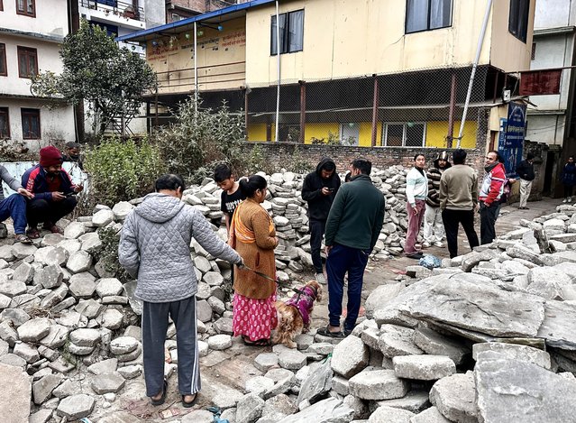 Nepalese people gather after getting out of their homes following an early morning earthquake in Kathmandu, Nepal, 07 January 2025. (Photo by Sunil Sharma/EPA/EFE)