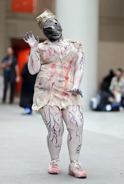 A Comic Con attendee poses as the nurse from Silent Hill during the 2014 New York Comic Con at Jacob Javitz Center on October 9, 2014 in New York City. (Photo by Daniel Zuchnik/Getty Images)
