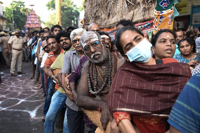Hindu devotees pull a chariot by tugging its ropes during the chariot festival at Kapaleeswarar Temple in Chennai on April 9, 2025. (Photo by R.Satish Babu/AFP Photo)