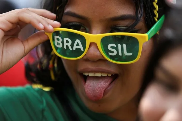A Brazilian fan reacts while watching the World Cup's match between Brazil and Switzerland at Alvorada neighborhood, in Manaus, Brazil on November 28, 2022. (Photo by Bruno Kelly/Reuters)