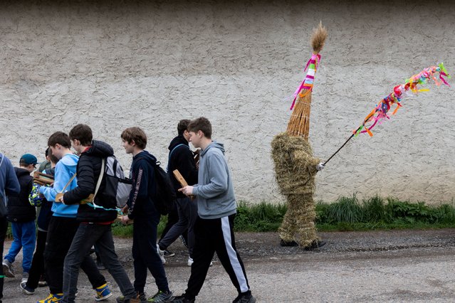 A boy dressed in a hay suit walks through the village as a part of an Easter celebration called 'Marching Judas', on Holy Saturday, in the village of Stradoun near Vysoke Myto, Czech Republic, on April 19, 2025. (Photo by Eva Korinkova/Reuters)