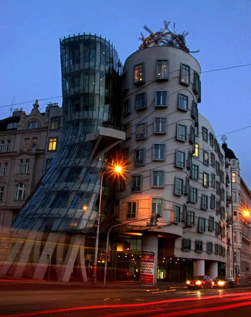 In this April 3, 2004 file picture of “Ginger and Fred”, two towers of a modernist building placed at Rasinovo Nabrezi in Prague, Czech Republic. For many of millions tourists from all over the globe who flood the picturesque Czech capital every year, to take a selfie in front of Prague’s Dancing House has become as obvious part of their visit as a walk on a medieval Charles Bridge. Now, they have an option to stay there as part of it has been turned into a hotel with a magnificent view from its rooms. (Photo by Petr David Josek/AP Photo)